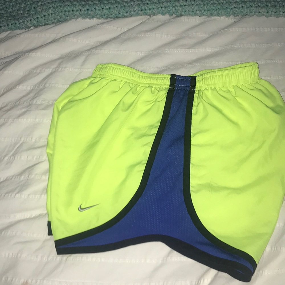 Neon yellow black and blue athletic shorts